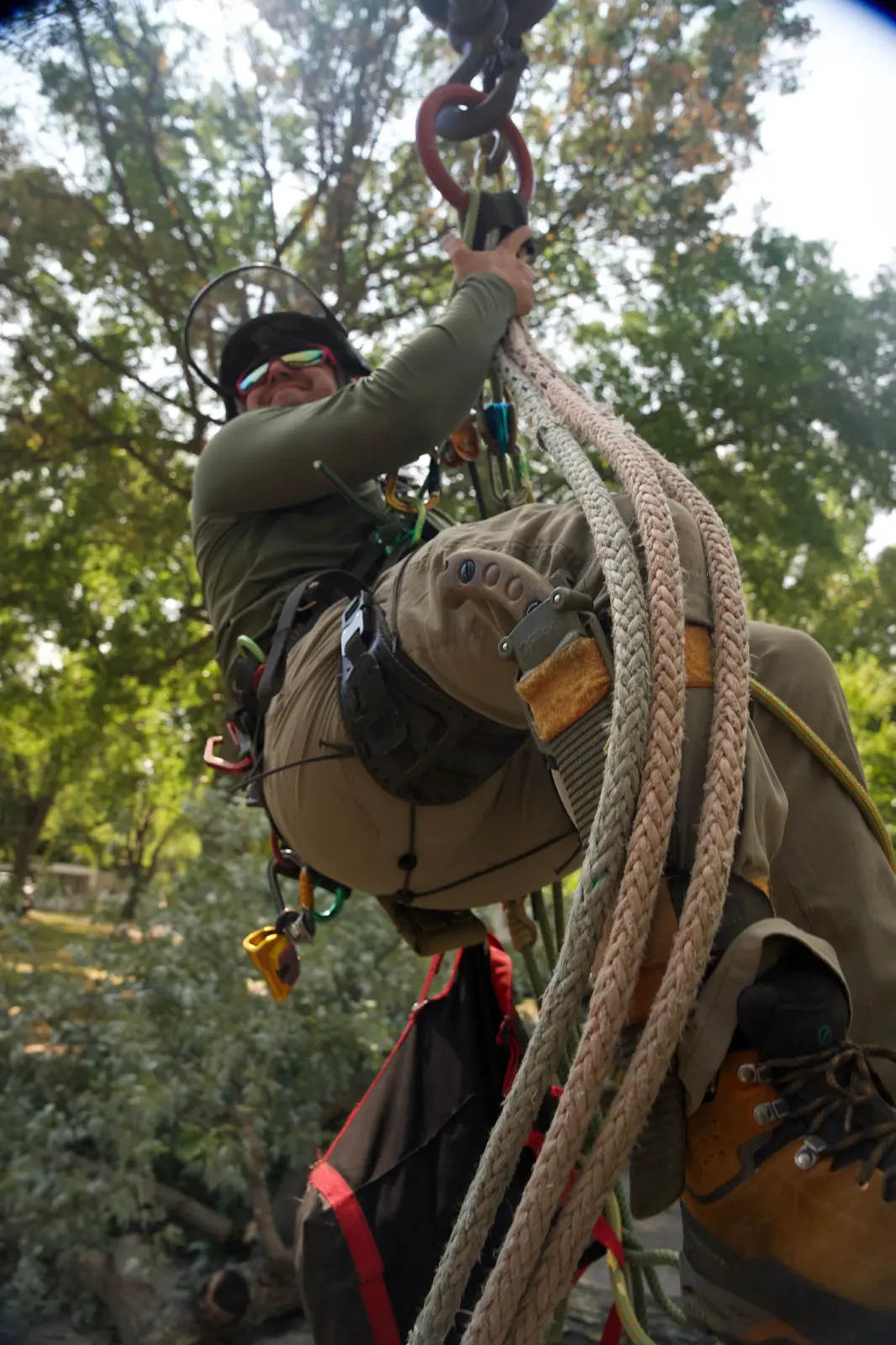 person climbing using rope